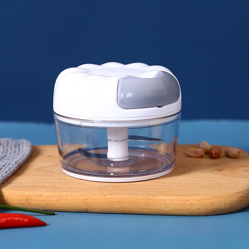 White pull-cord mini garlic chopper with a clear bowl