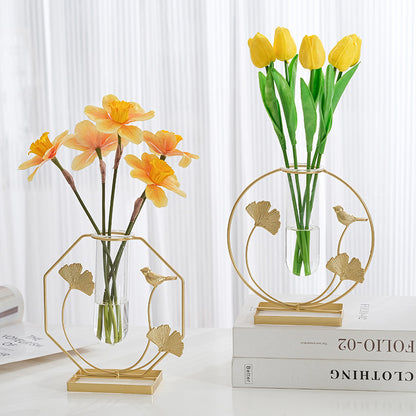 Iron and glass vase on table setting