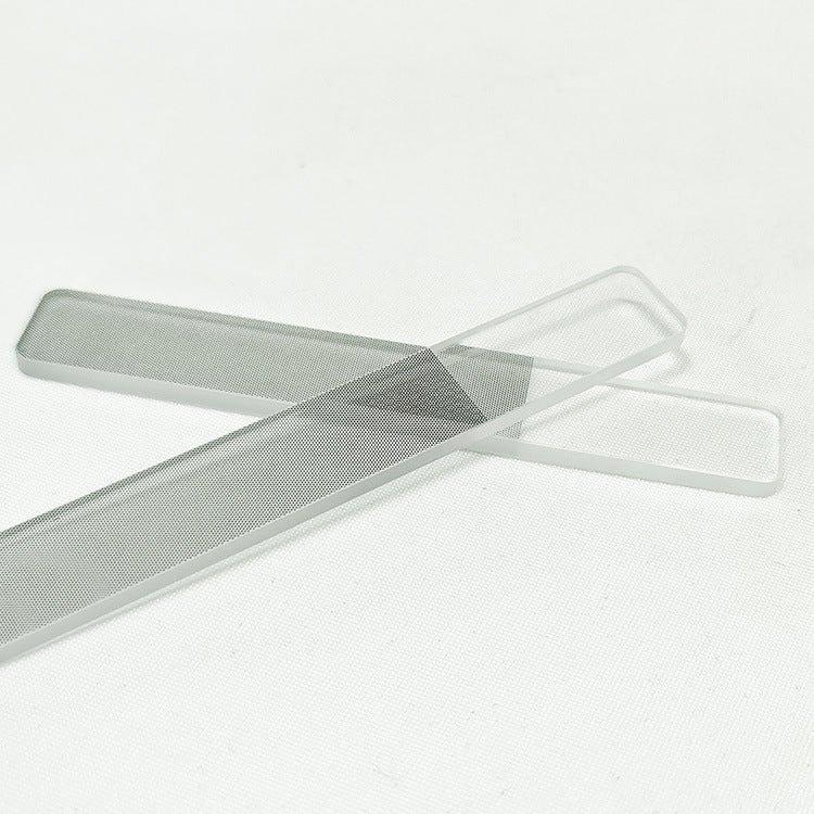 Two glass nail files on a red cloth