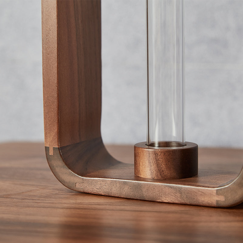 Clear glass flower vase on table