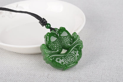 Hetian jade fish pendant symbolizing abundance, front view