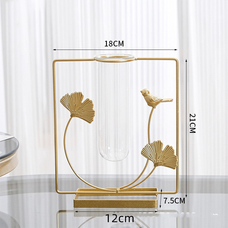 Iron and glass vase with flowers