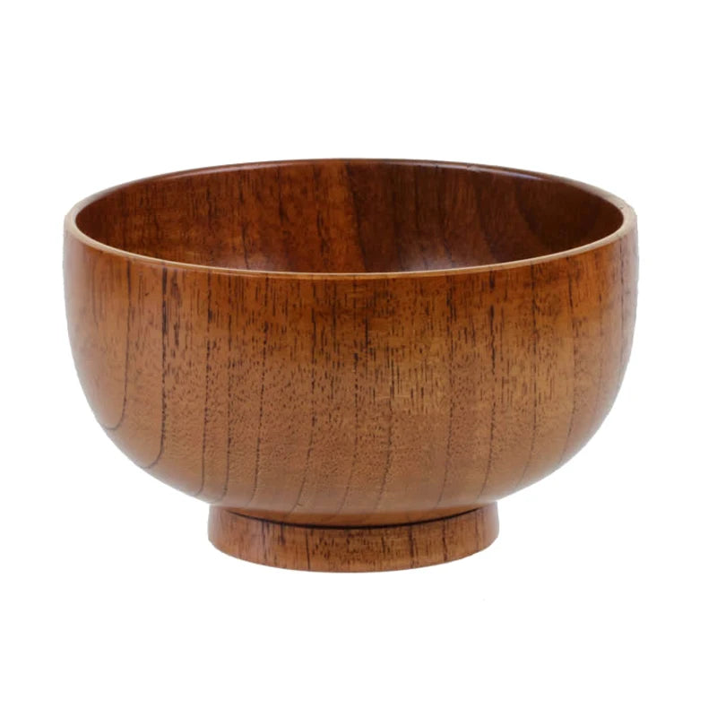 Wooden bowl serving food closeup