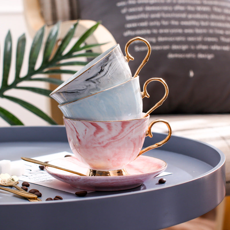 Ceramic tea cup and saucer set on table